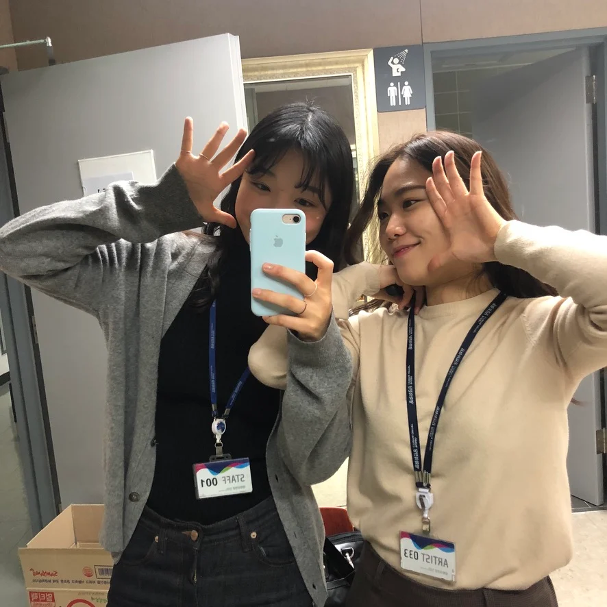A backstage mirror photograph with staff passes