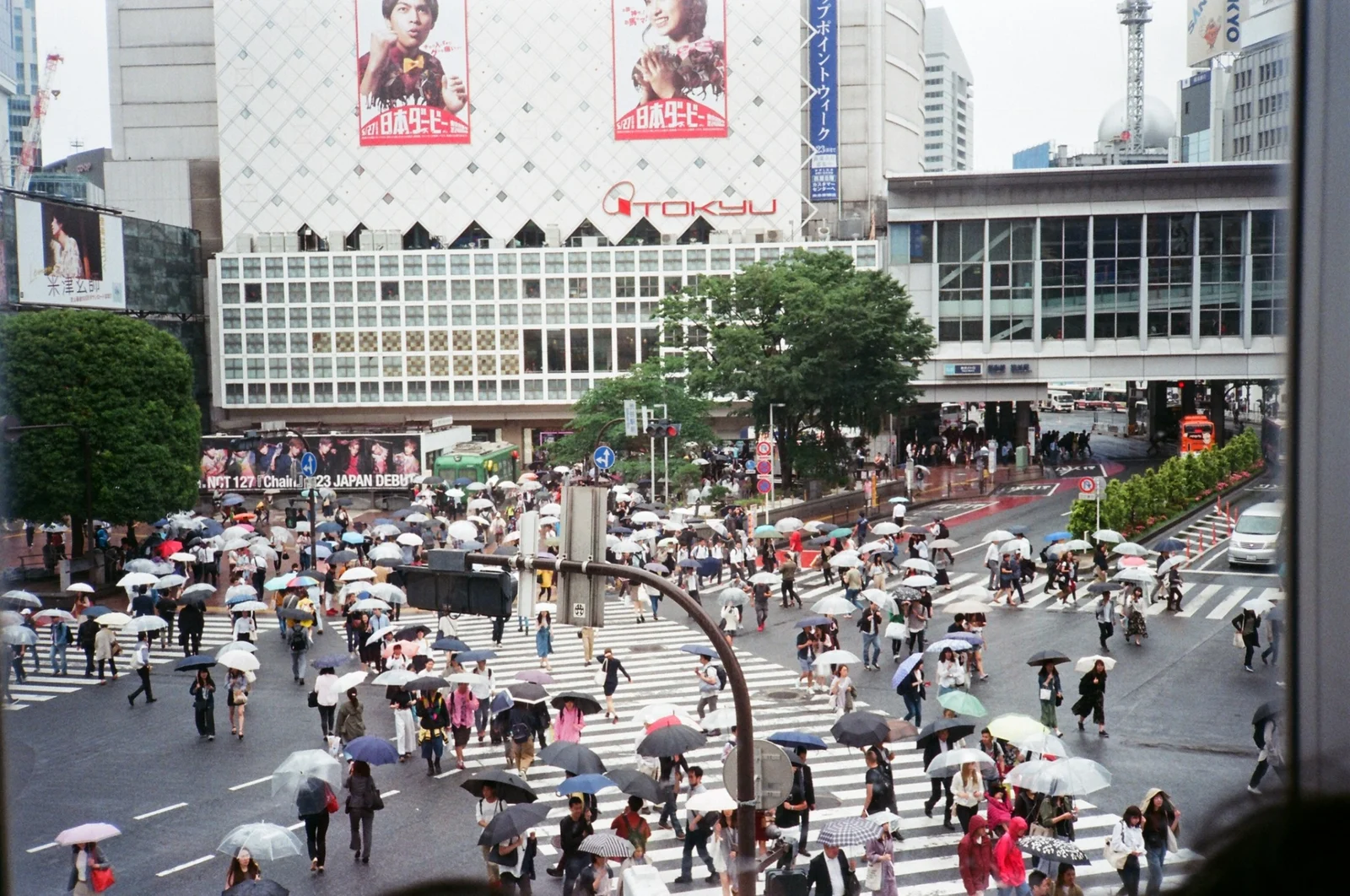 A busy city crossing photographed on film