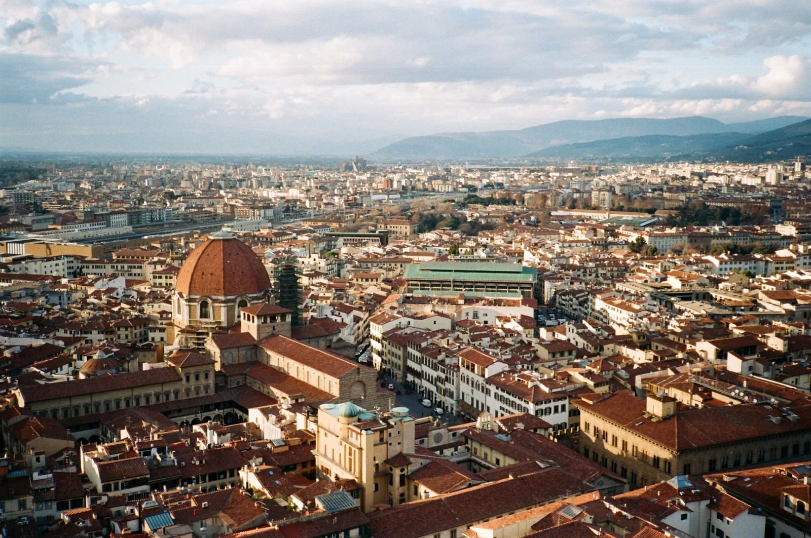 A city of terracotta rooftops photographed on film