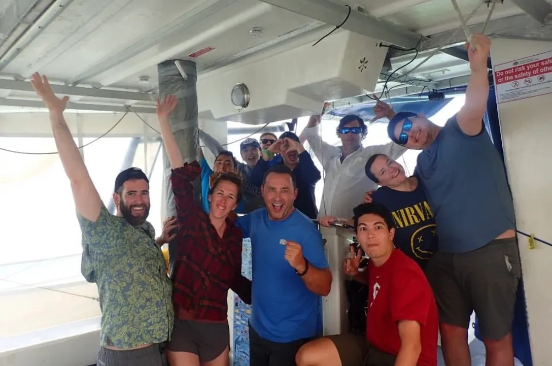 A group photograph together on a boat