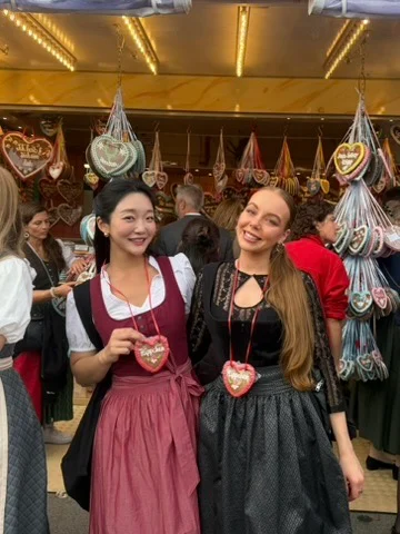 Two travelers in traditional festival dresses